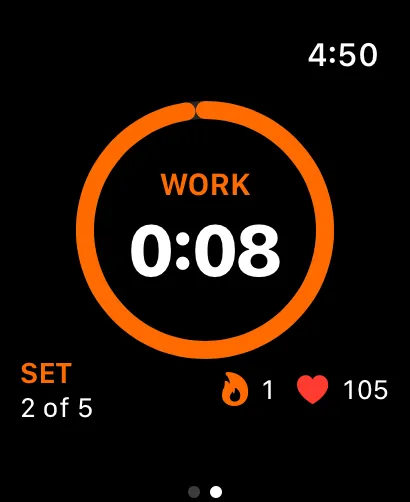 Work interval with a full orange progress ring, set count and live heart rate