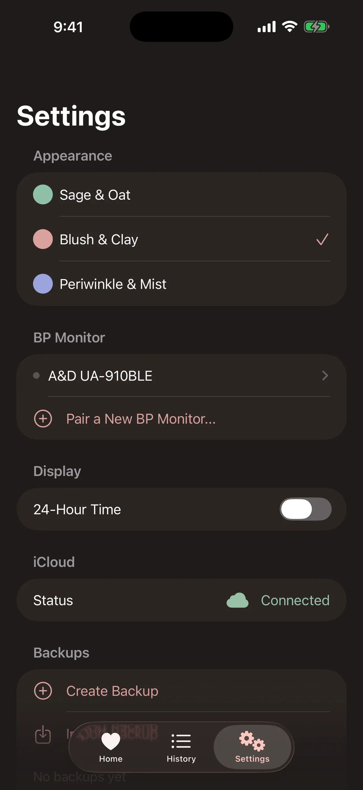 Settings in dark mode with color themes, the paired monitor, iCloud status, and backups